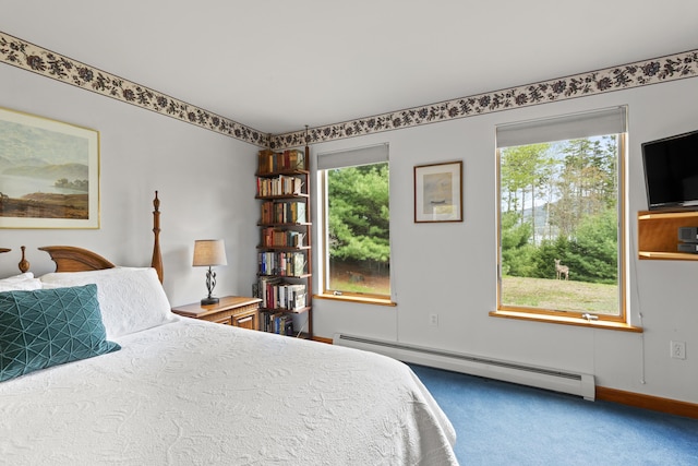 68 Parker Farm Rd, Mount Desert, ME 04660 - carpeted bedroom with a baseboard heating unit, multiple windows, and baseboards