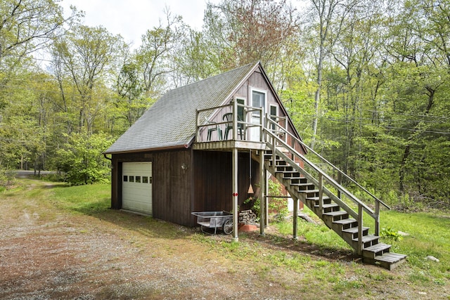 711 Biscay Rd, Bremen, ME 04551 - view of outdoor structure with stairway, dirt driveway, and a view of trees