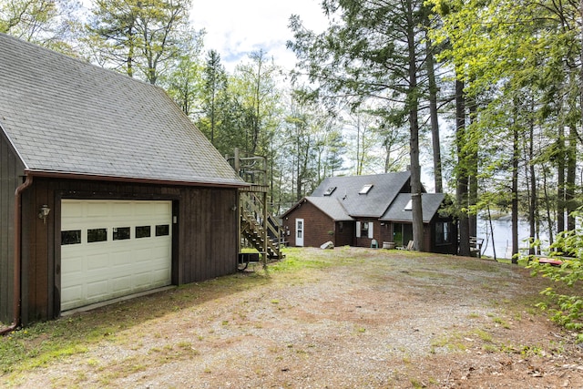 711 Biscay Rd, Bremen, ME 04551 - view of side of property featuring stairs and a detached garage