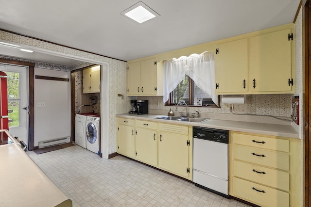 711 Biscay Rd, Bremen, ME 04551 - kitchen with dishwasher, washer and clothes dryer, a sink, cream cabinetry, and a baseboard radiator