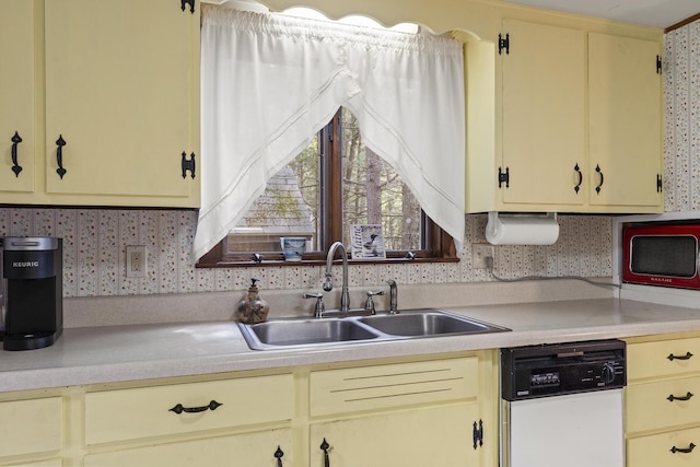 711 Biscay Rd, Bremen, ME 04551 - kitchen with dishwasher, light countertops, and cream cabinets