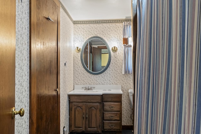 711 Biscay Rd, Bremen, ME 04551 - bathroom featuring wallpapered walls, vanity, and toilet