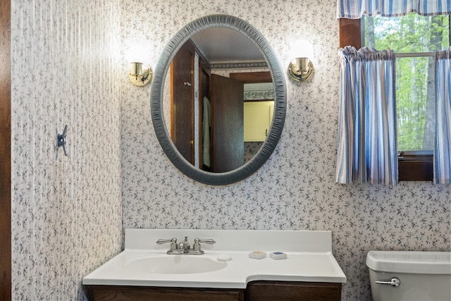 711 Biscay Rd, Bremen, ME 04551 - half bathroom featuring vanity, toilet, and wallpapered walls