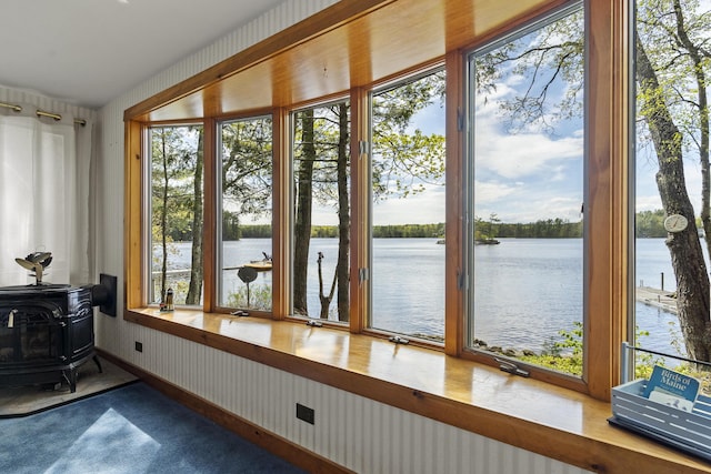 711 Biscay Rd, Bremen, ME 04551 - sunroom with a water view, a wood stove, and healthy amount of natural light