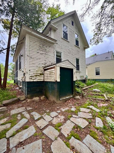 3 King St, Sanford, ME 04083 - back of house with a storage unit and an outdoor structure