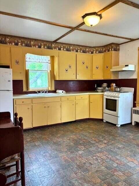 3 King St, Sanford, ME 04083 - kitchen with white appliances, a sink, under cabinet range hood, and cream cabinetry