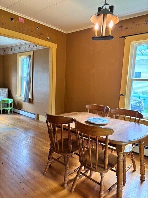 3 King St, Sanford, ME 04083 - dining room with a baseboard radiator, crown molding, and wood finished floors