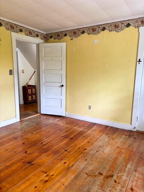 3 King St, Sanford, ME 04083 - empty room featuring hardwood / wood-style flooring, baseboards, and ornamental molding