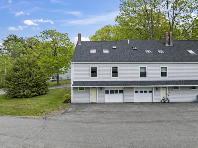 801 US Route 1 Unit C1, York, ME 03909 - rear view of property featuring a chimney, roof with shingles, asphalt driveway, and an attached garage