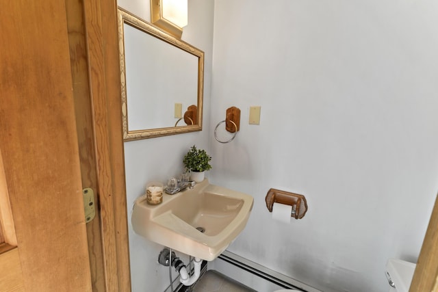 801 US Route 1 Unit C1, York, ME 03909 - half bath with baseboard heating, a sink, and toilet