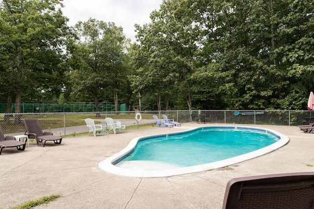 801 US Route 1 Unit C1, York, ME 03909 - community pool featuring a patio area and view of scattered trees