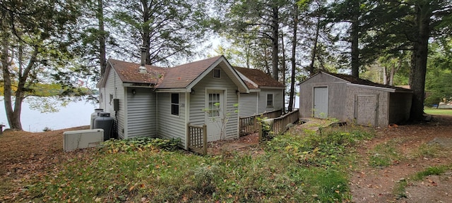 208 Camp Rd, Cooper, ME 04657 - view of side of home featuring a storage shed and an outdoor structure