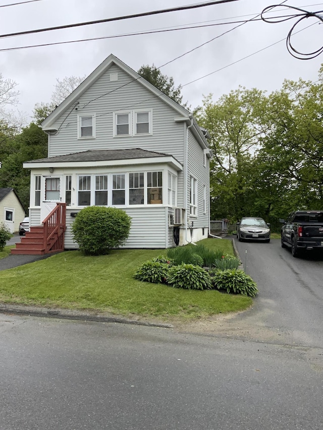 39 Oak St, Waterville, ME 04901 - view of front of property featuring a front yard, roof with shingles, and asphalt driveway