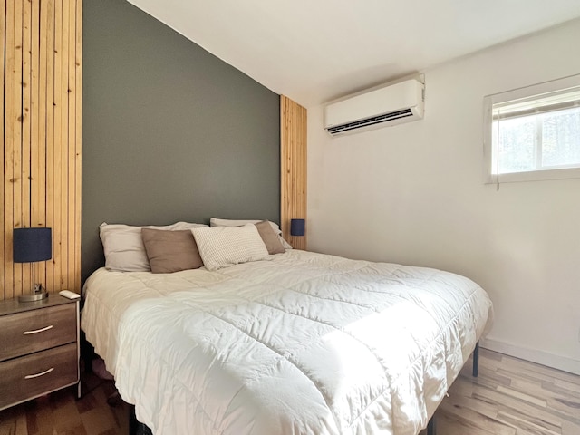 80 Bluejay Ln, Waltham, ME 04605 - bedroom featuring an AC wall unit, dark wood-type flooring, and lofted ceiling