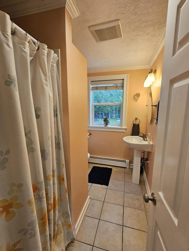 33 Oak Ridge Dr, Standish, ME 04084 - full bath with a baseboard radiator, baseboards, tile patterned floors, a textured ceiling, and crown molding