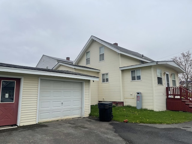 1 S Park St, Caribou, ME 04736 - view of property exterior with asphalt driveway and a garage