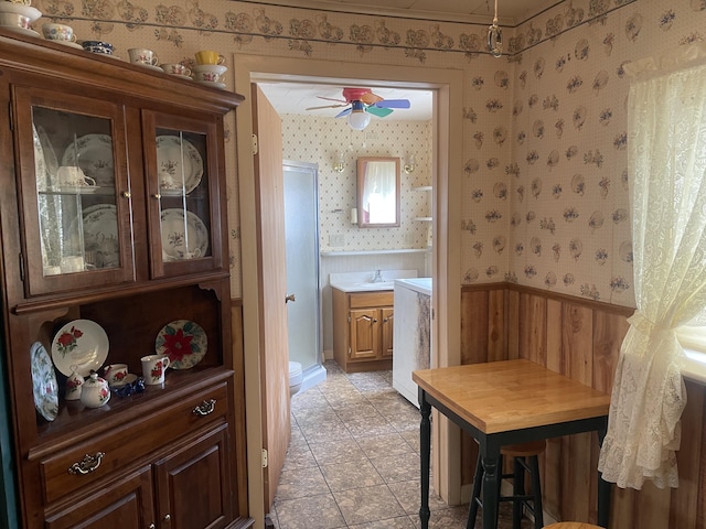 1 S Park St, Caribou, ME 04736 - dining room with wallpapered walls, a ceiling fan, and light tile patterned floors