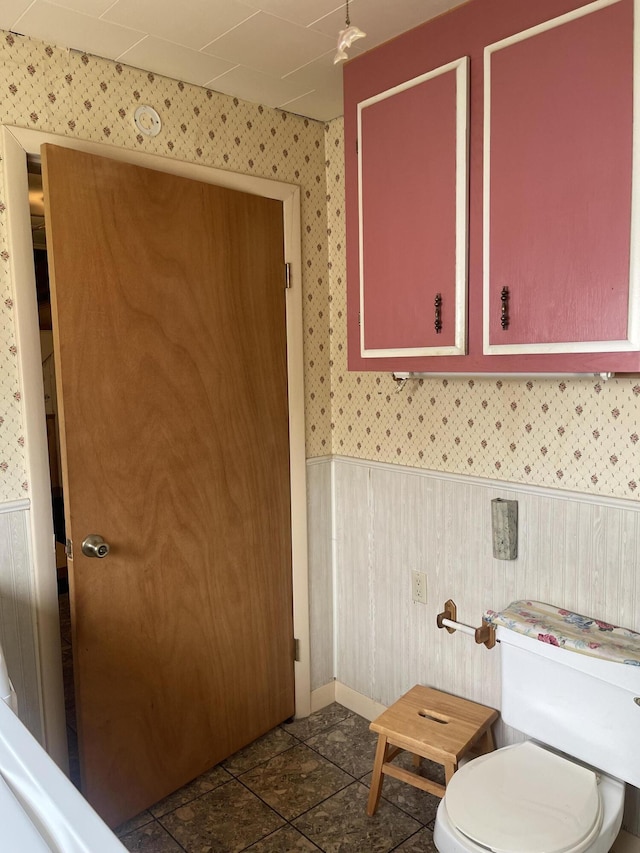 1 S Park St, Caribou, ME 04736 - bathroom with wallpapered walls, wainscoting, and toilet
