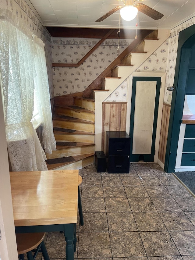 1 S Park St, Caribou, ME 04736 - stairway with wallpapered walls and ceiling fan
