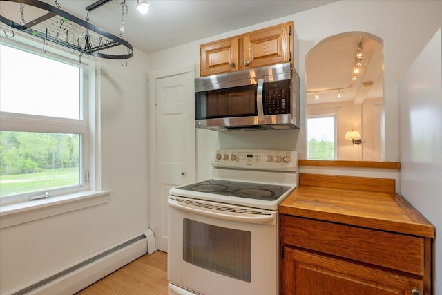 229 Choate Rd, Montville, ME 04941 - kitchen featuring stainless steel microwave, white range with electric stovetop, a baseboard heating unit, rail lighting, and wood counters