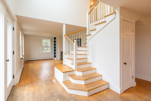 229 Choate Rd, Montville, ME 04941 - entryway featuring stairs, wood finished floors, a baseboard radiator, and baseboards