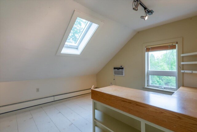 229 Choate Rd, Montville, ME 04941 - additional living space featuring a baseboard heating unit, vaulted ceiling, a skylight, and a wall mounted AC