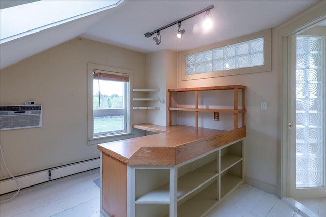 229 Choate Rd, Montville, ME 04941 - unfurnished office featuring an AC wall unit, a baseboard radiator, track lighting, and vaulted ceiling