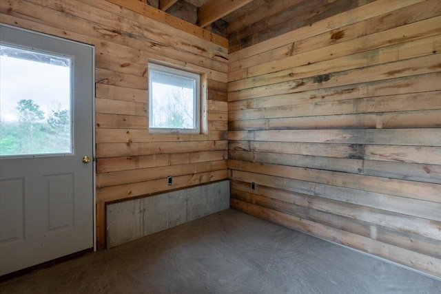 229 Choate Rd, Montville, ME 04941 - unfurnished room featuring wooden walls and concrete floors