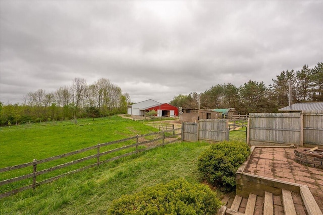 229 Choate Rd, Montville, ME 04941 - view of yard featuring an outdoor structure, an exterior structure, and an outdoor fire pit