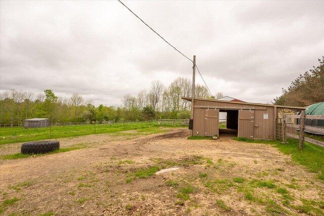 229 Choate Rd, Montville, ME 04941 - view of yard with an outdoor structure and an exterior structure