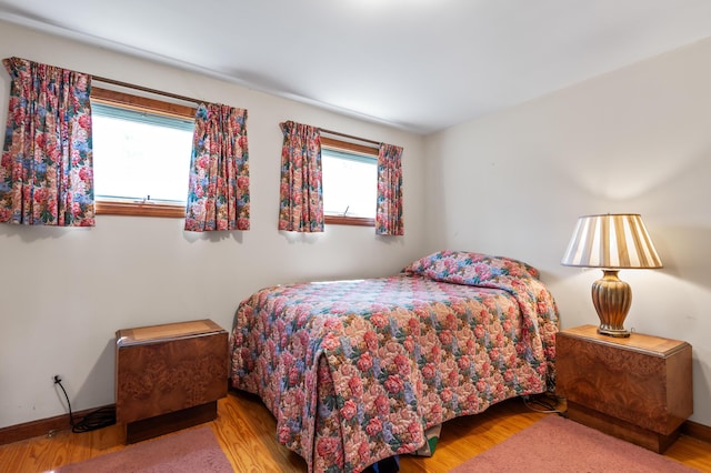 641 Bald Mountain Rd, Rangeley, ME 04970 - bedroom with wood finished floors and baseboards