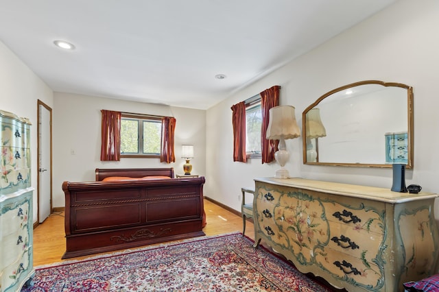 641 Bald Mountain Rd, Rangeley, ME 04970 - bedroom featuring multiple windows, light wood-style floors, baseboards, and recessed lighting