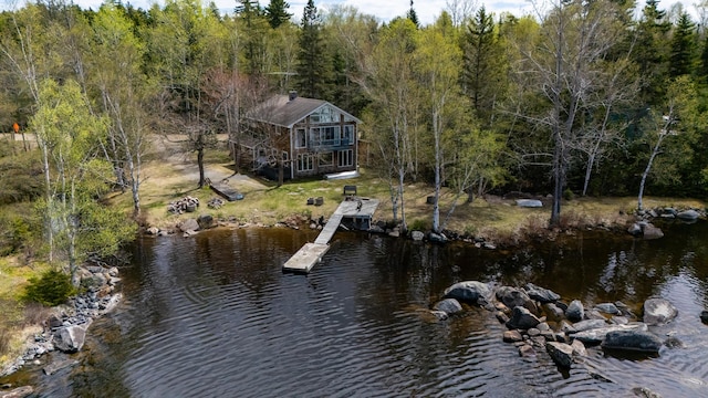 641 Bald Mountain Rd, Rangeley, ME 04970 - dock area with a water view, a wooded view, and a lawn