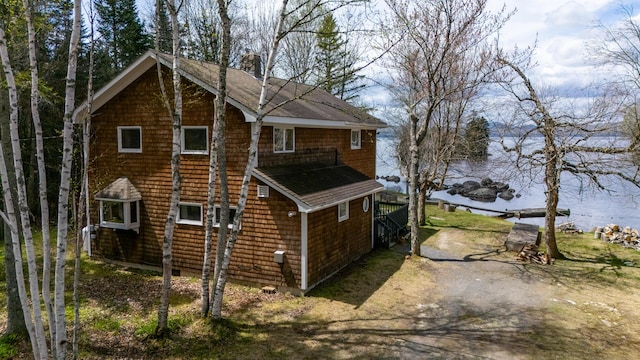 641 Bald Mountain Rd, Rangeley, ME 04970 - view of side of home with a chimney and a shingled roof
