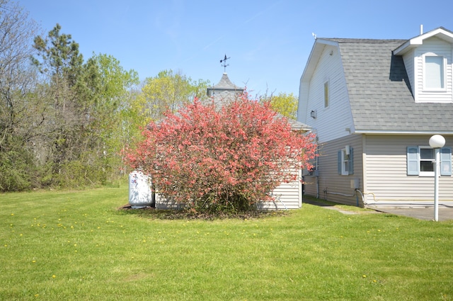 42 Blanchard St, Bangor, ME 04401 - view of property exterior with a lawn and a shingled roof