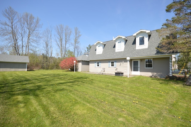 42 Blanchard St, Bangor, ME 04401 - rear view of house with a lawn, a shingled roof, and cooling unit