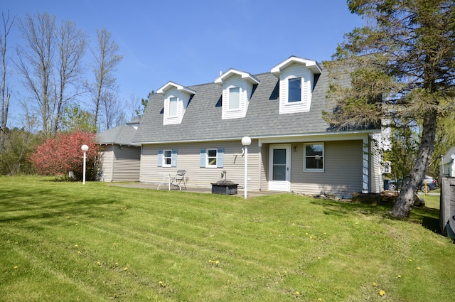 42 Blanchard St, Bangor, ME 04401 - back of house with a lawn, a shingled roof, cooling unit, and a patio
