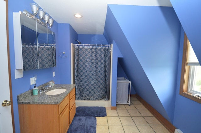 42 Blanchard St, Bangor, ME 04401 - bathroom with vanity, a stall shower, tile patterned flooring, a baseboard heating unit, and baseboards