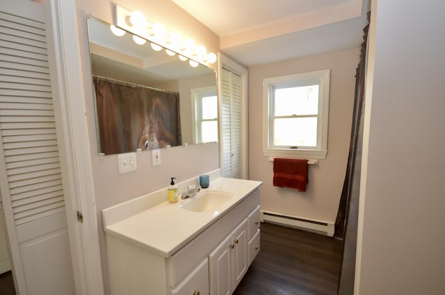 42 Blanchard St, Bangor, ME 04401 - full bath with a baseboard radiator, vanity, and wood finished floors