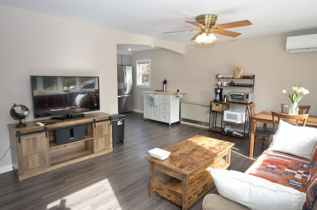 42 Blanchard St, Bangor, ME 04401 - living room with a ceiling fan, dark wood-type flooring, arched walkways, a wall mounted air conditioner, and baseboards
