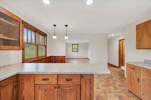 626 Main Rd, Eddington, ME 04428 - kitchen with a peninsula, light countertops, recessed lighting, baseboard heating, and pendant lighting