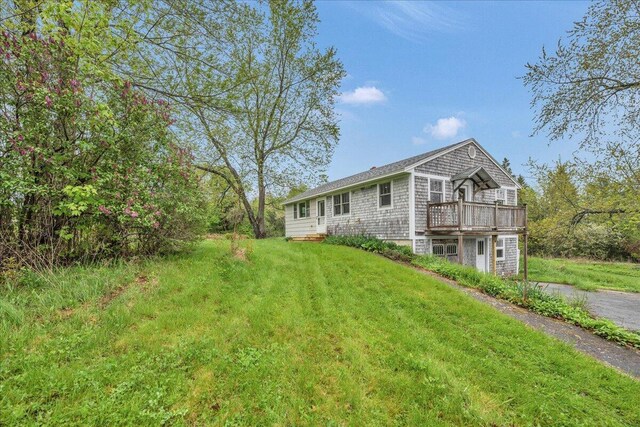 626 Main Rd, Eddington, ME 04428 - back of house featuring a deck and a yard