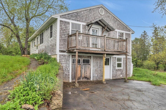 626 Main Rd, Eddington, ME 04428 - shingle-style home featuring a balcony