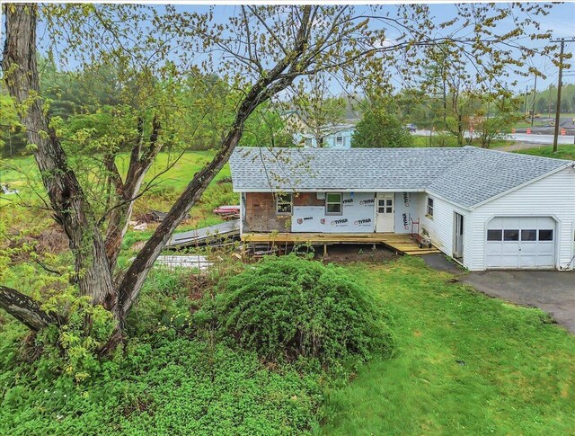626 Main Rd, Eddington, ME 04428 - property under construction featuring a garage, roof with shingles, asphalt driveway, and a front lawn
