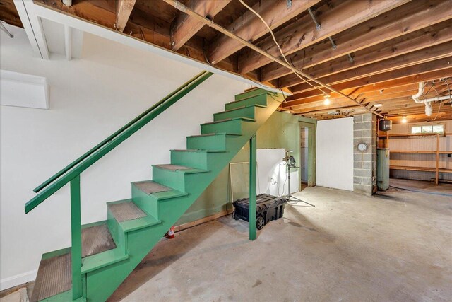 626 Main Rd, Eddington, ME 04428 - unfinished below grade area with stairway and water heater
