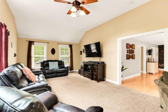 77 Cemetery Rd, Berwick, ME 03901 - living room with light carpet, ceiling fan, lofted ceiling, and baseboards