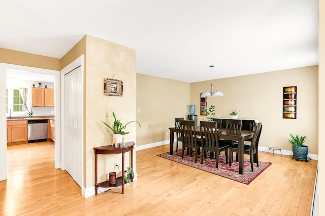 77 Cemetery Rd, Berwick, ME 03901 - dining area featuring light wood finished floors, a chandelier, and baseboards