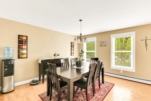 77 Cemetery Rd, Berwick, ME 03901 - dining space featuring a chandelier, light wood finished floors, a baseboard heating unit, and baseboards
