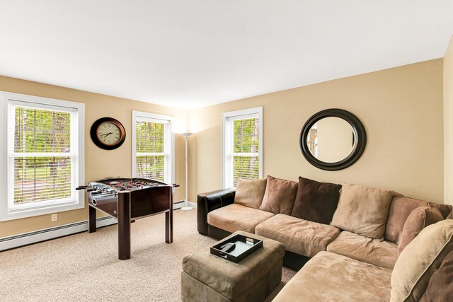 77 Cemetery Rd, Berwick, ME 03901 - carpeted living area featuring healthy amount of natural light, baseboards, and a baseboard heating unit
