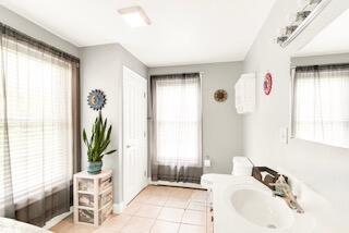 77 Cemetery Rd, Berwick, ME 03901 - bathroom with healthy amount of natural light, tile patterned floors, and vanity